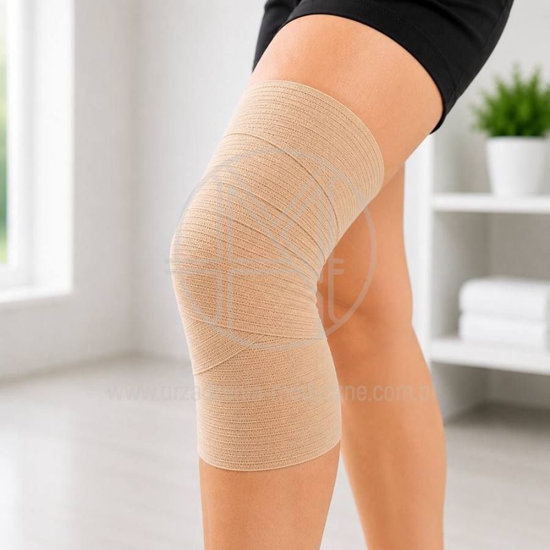 Bandaż kohezyjny 10 cm zastosowany do stabilizacji stawu kolanowego